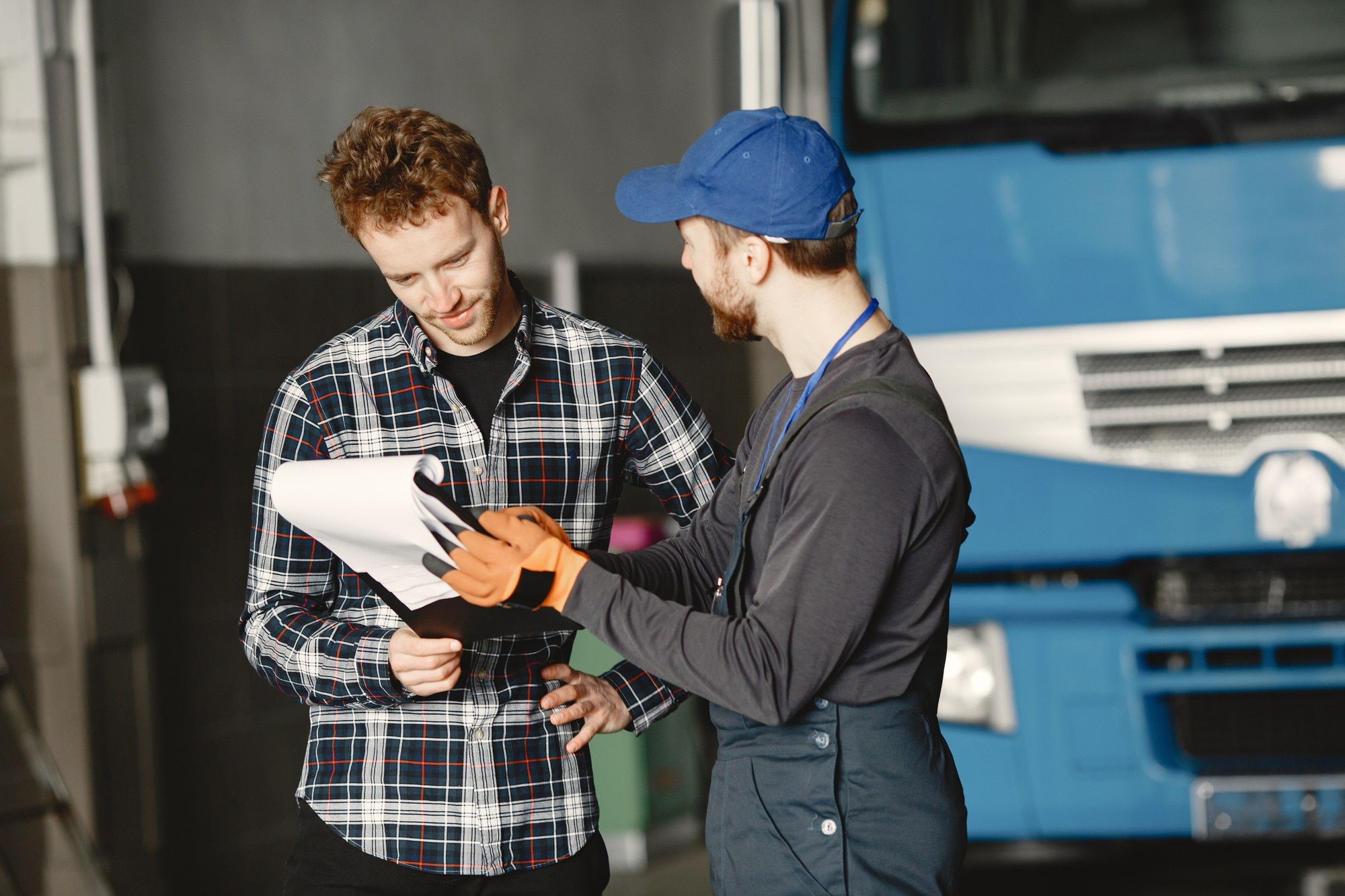 Two workshop employees discussing their work